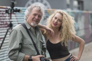 Photographer with blonde model on location